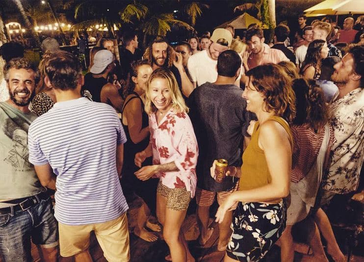Guests dancing in the garden at night